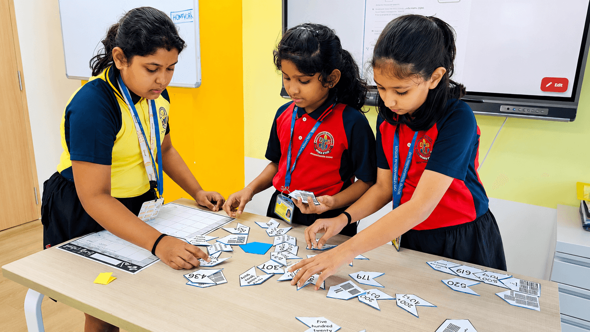 Teacher guiding young students